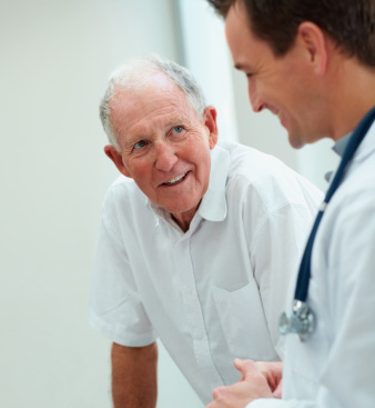 Happy senior man talking to a doctor