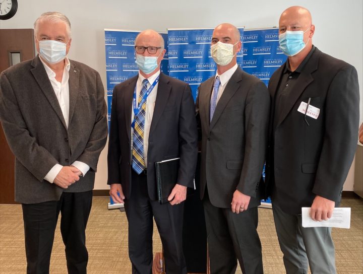 Governor Steve Sisolak; Mesa View Regional Hospital CEO Kelly Adams; Walter Panzirer, a trustee for the Helmsley Charitable Trust; and Tom Maher, Boulder City Hospital CEO