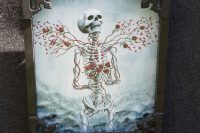 skeleton with roses painting